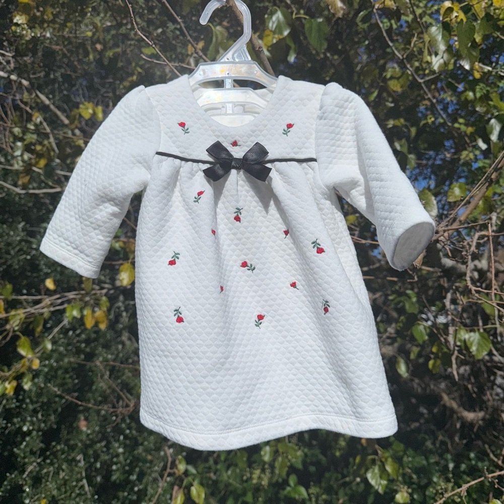 White Quilted Baby Dress with Black Bow and Floral Embroidery